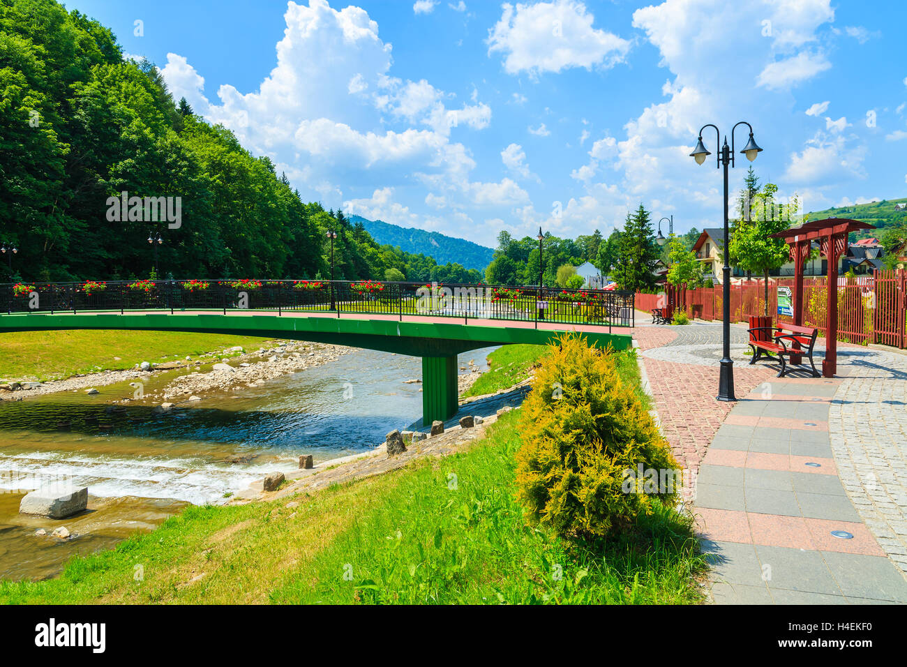 Bridge over a river in Szczawnica village on sunny summer day, Beskid Niski Mountains, Poland Stock Photo