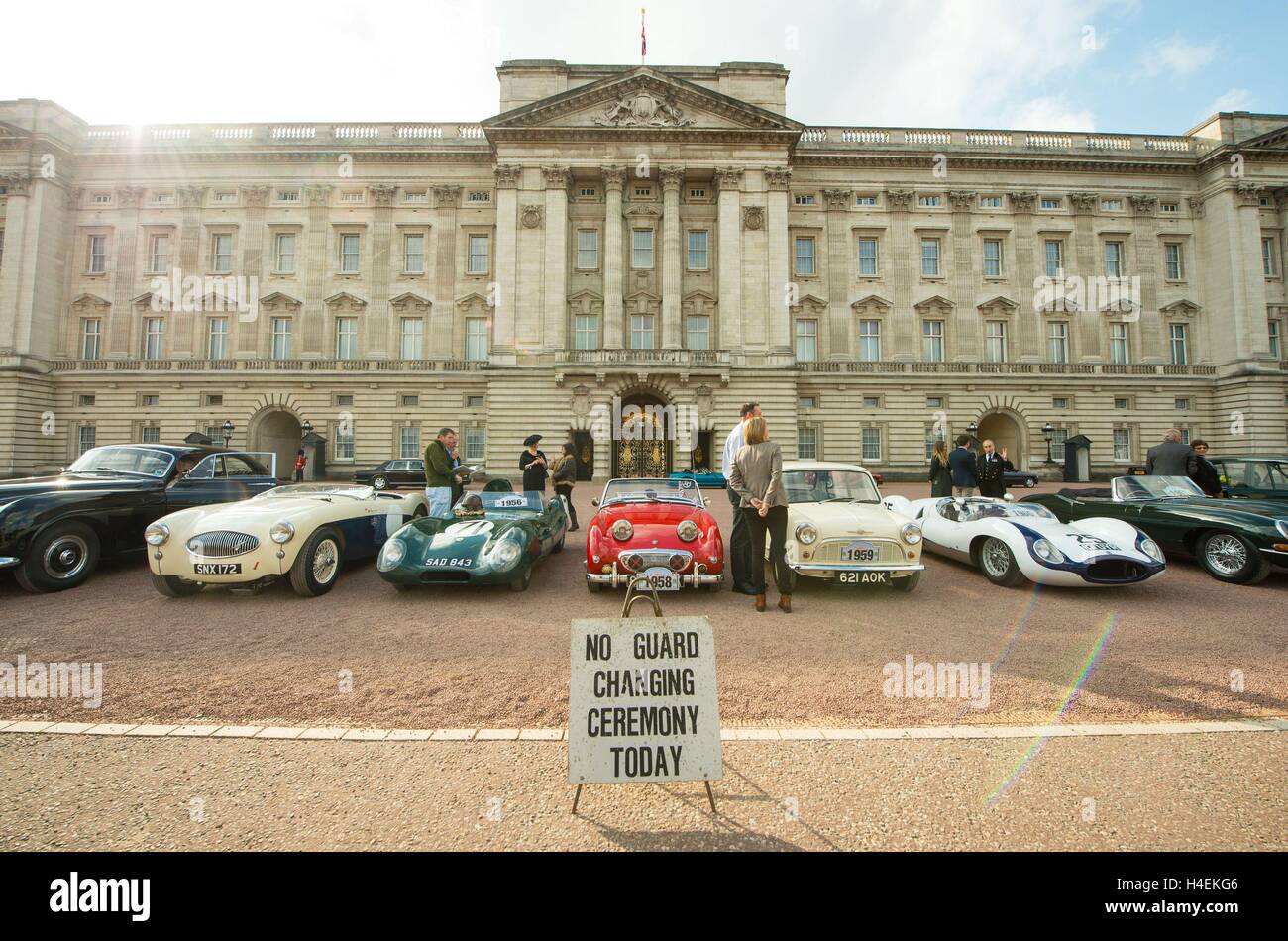 A display of 90 historic British-built motor vehicles in the forecourt of Buckingham Palace, London, to commemorate The Queen's 90th birthday. Stock Photo
