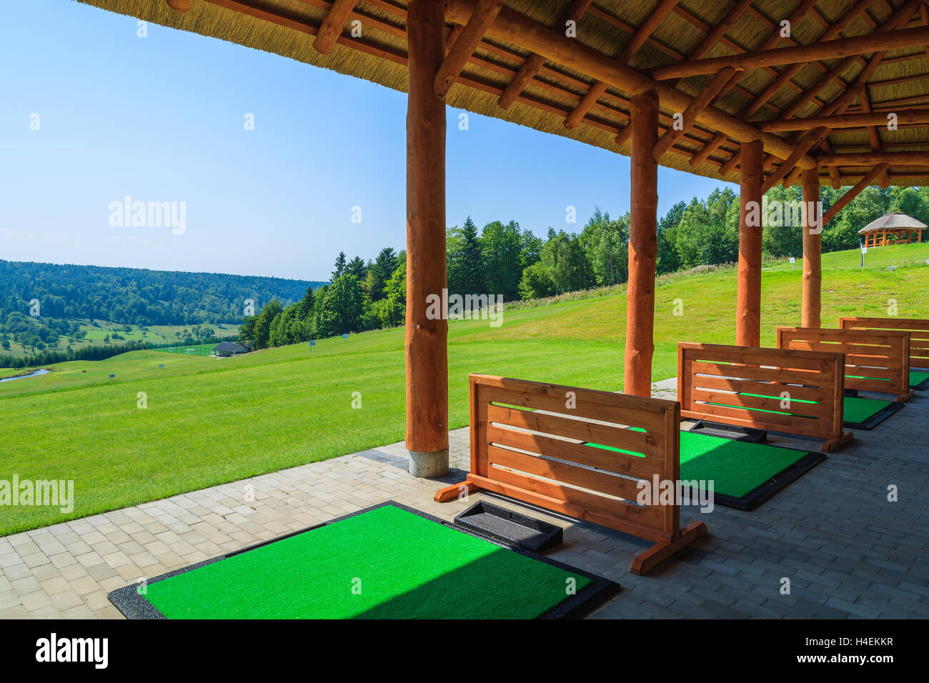 ARLAMOW GOLF COURSE, POLAND - AUG 3, 2014: beautiful golf play area on sunny summer day in Arlamow Hotel. This luxury hotel was owned by Poland's government and is located in Bieszczady Mountains. Stock Photo