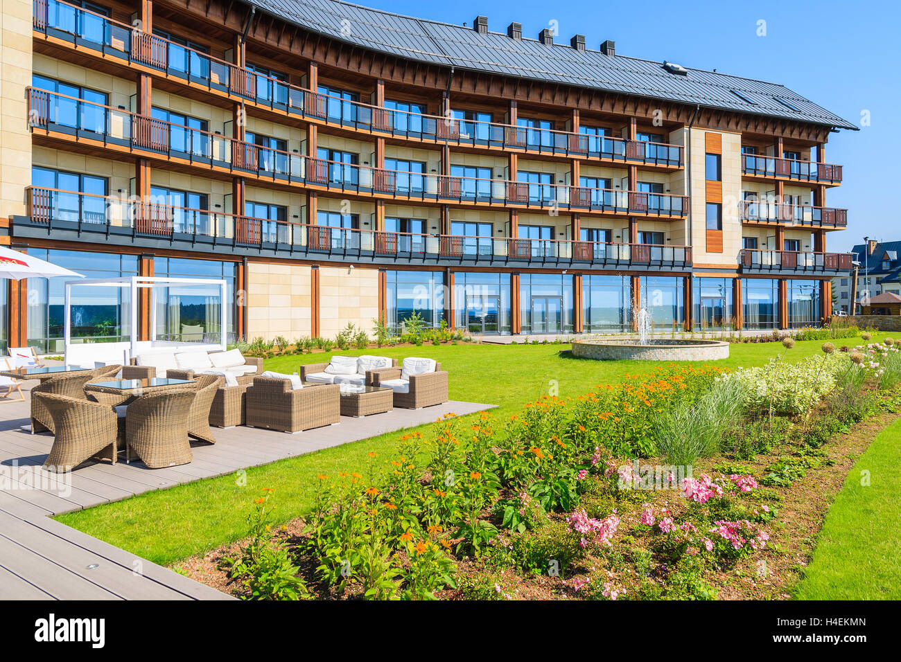 ARLAMOW HOTEL, POLAND - AUG 3, 2014: green garden in Arlamow Hotel. This luxury resort was owned by Poland's government and is located in Bieszczady Mountains. Stock Photo