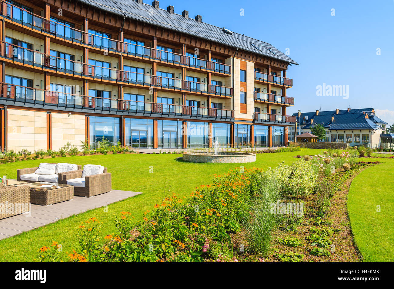 ARLAMOW HOTEL, POLAND - AUG 3, 2014: green garden in Arlamow Hotel. This luxury resort was owned by Poland's government and is located in Bieszczady Mountains. Stock Photo