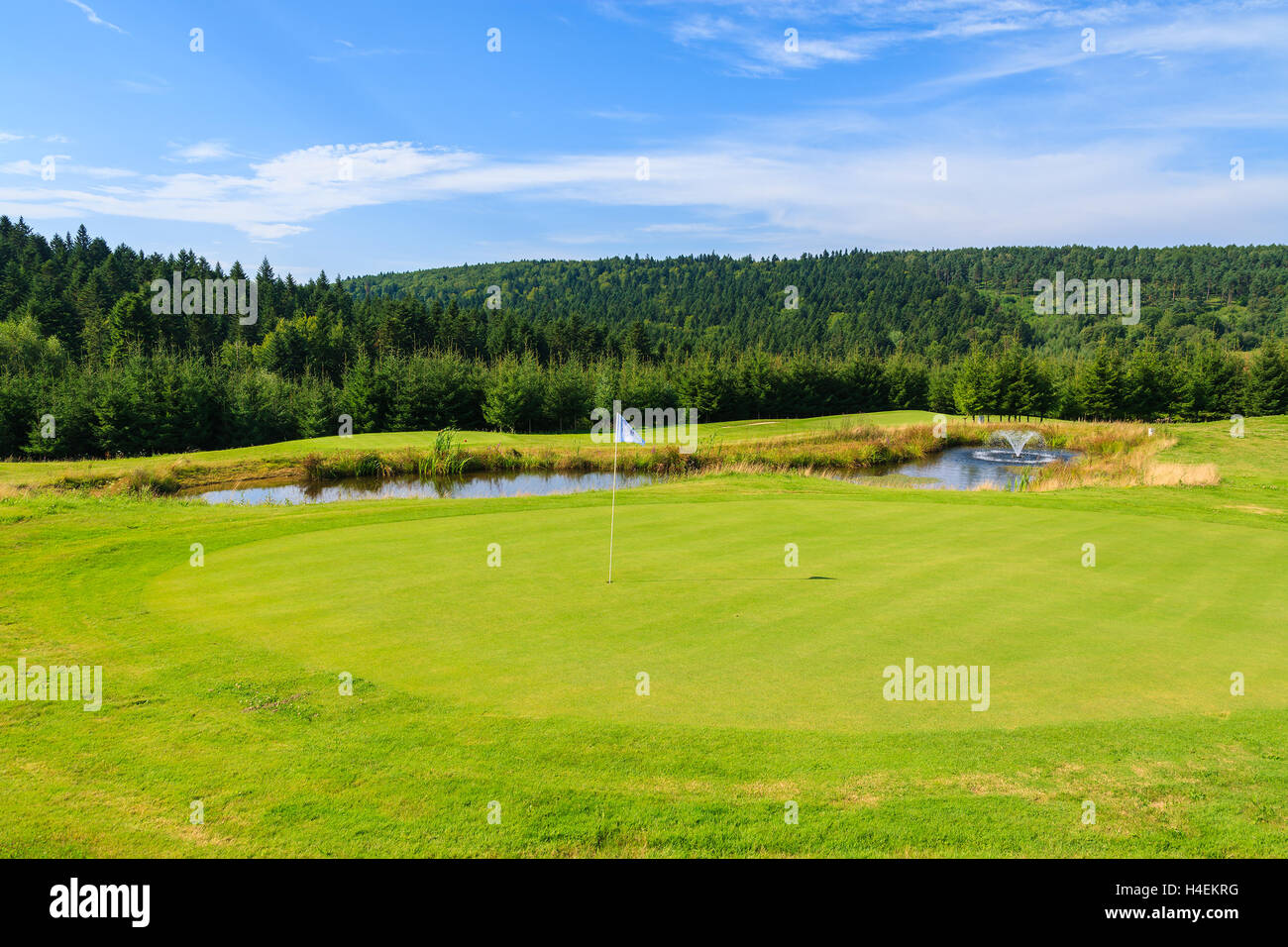 ARLAMOW GOLF COURSE, POLAND - AUG 3, 2014: beautiful golf play area on sunny summer day in Arlamow Hotel. This luxury hotel was owned by Poland's government and is located in Bieszczady Mountains. Stock Photo