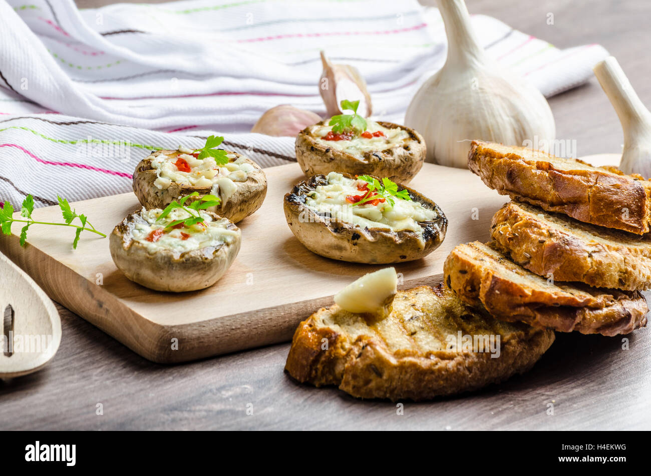 Grilled mushrooms stuffed with blue cheese and chilli and garlic toast