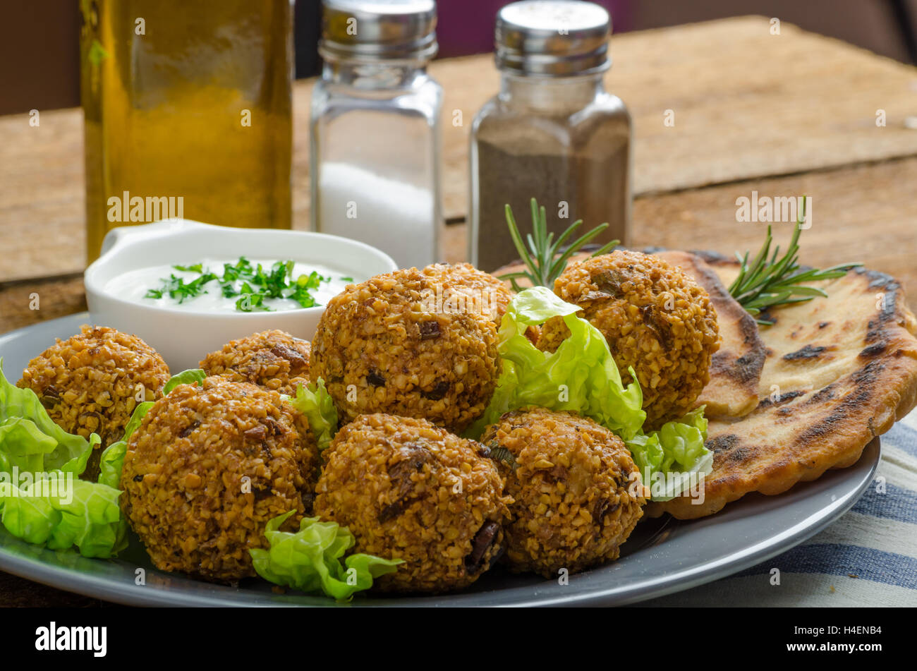 Health crunchy falafel with mint and garlic dip, naan bread with cumin