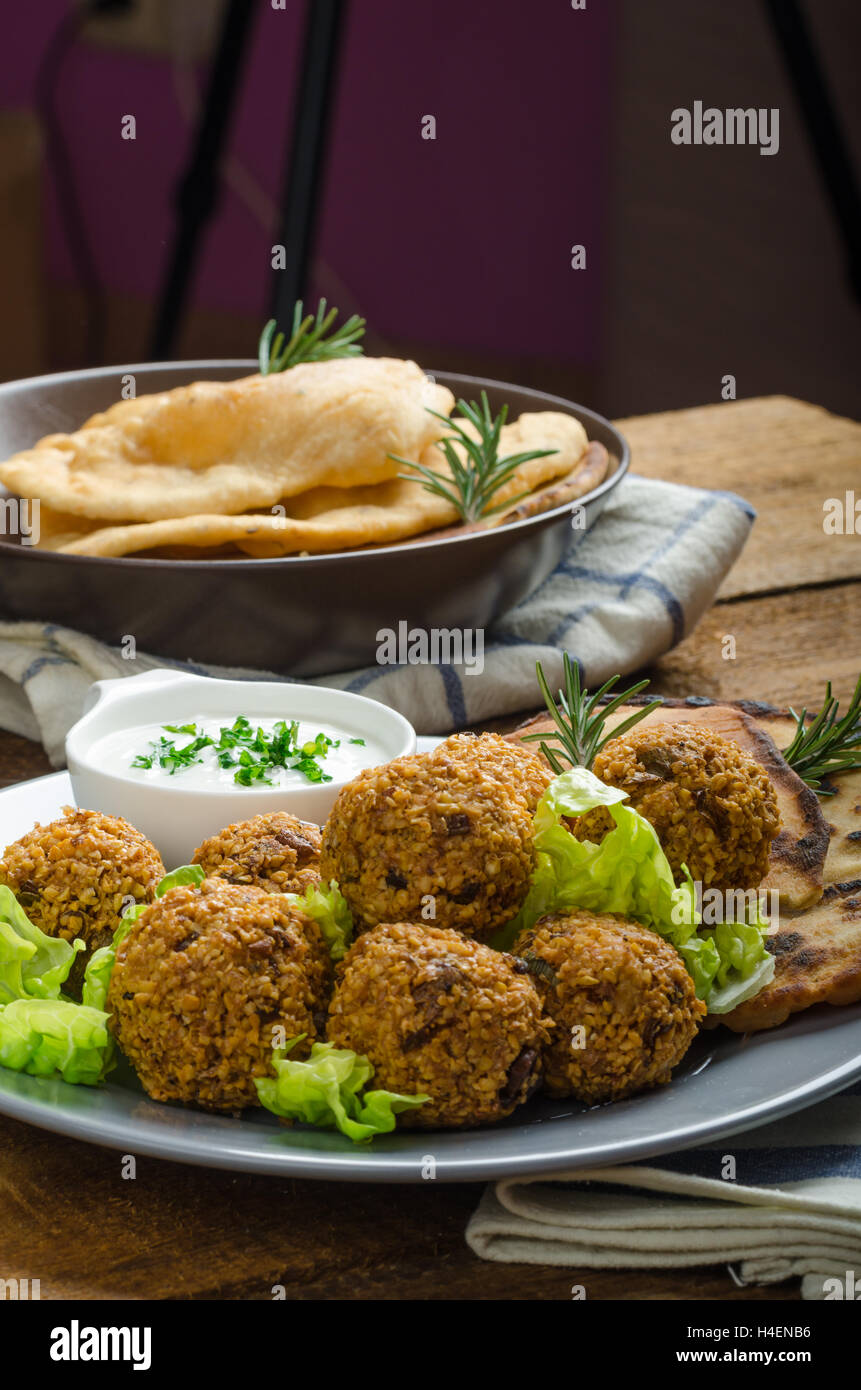 Health crunchy falafel with mint and garlic dip, naan bread with cumin