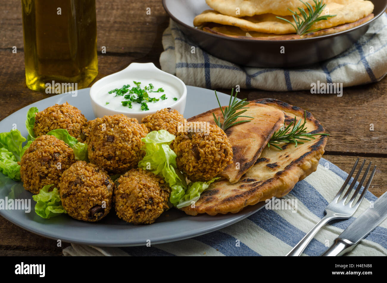 Health crunchy falafel with mint and garlic dip, naan bread with cumin