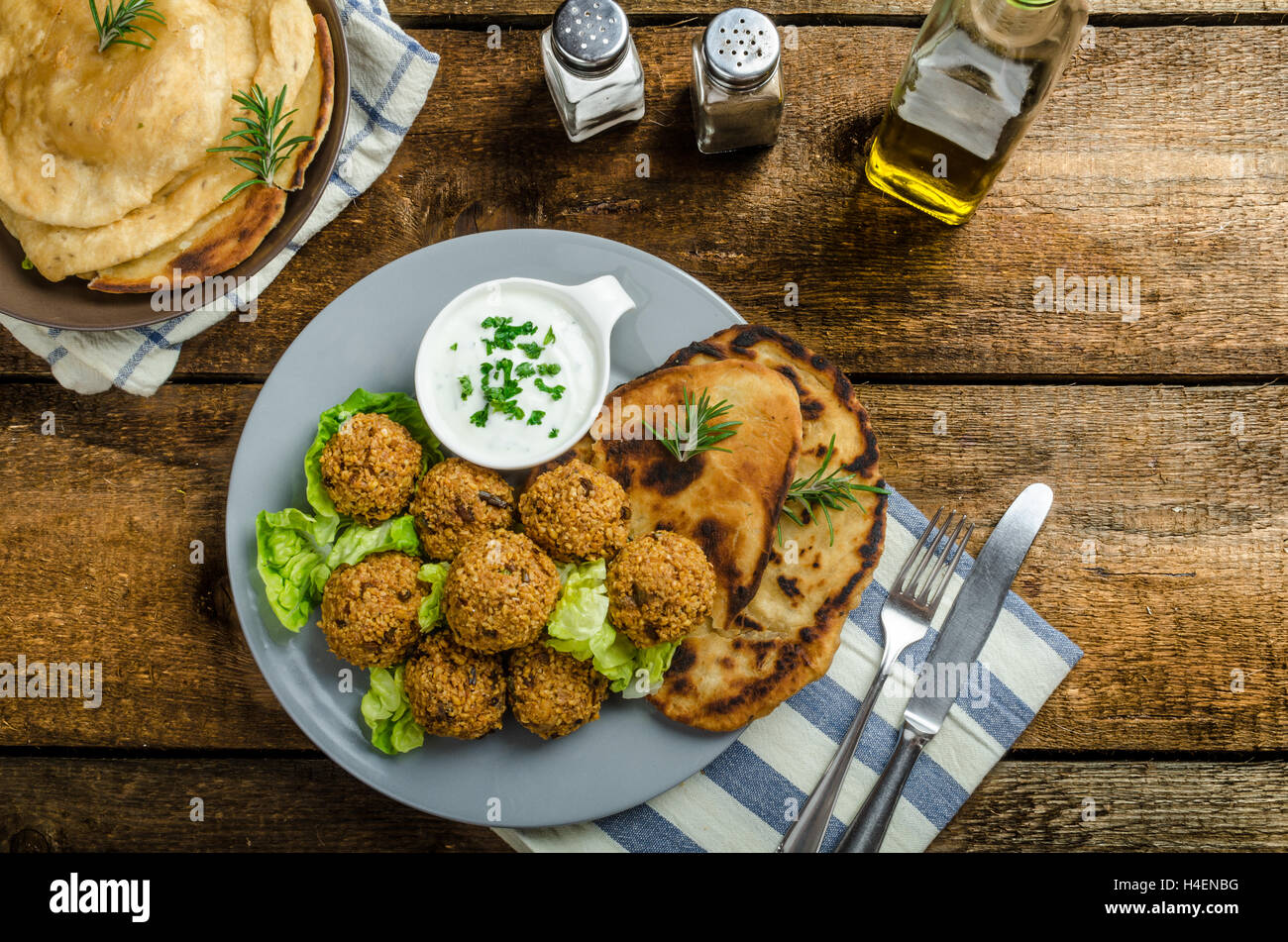 Health crunchy falafel with mint and garlic dip, naan bread with cumin