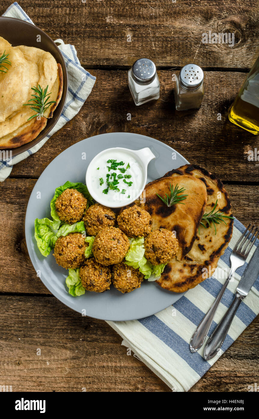 Health crunchy falafel with mint and garlic dip, naan bread with cumin