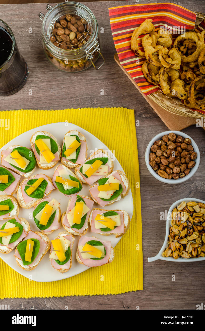 New Year's Eve meal canapes with ham, cheese and spinach leaves