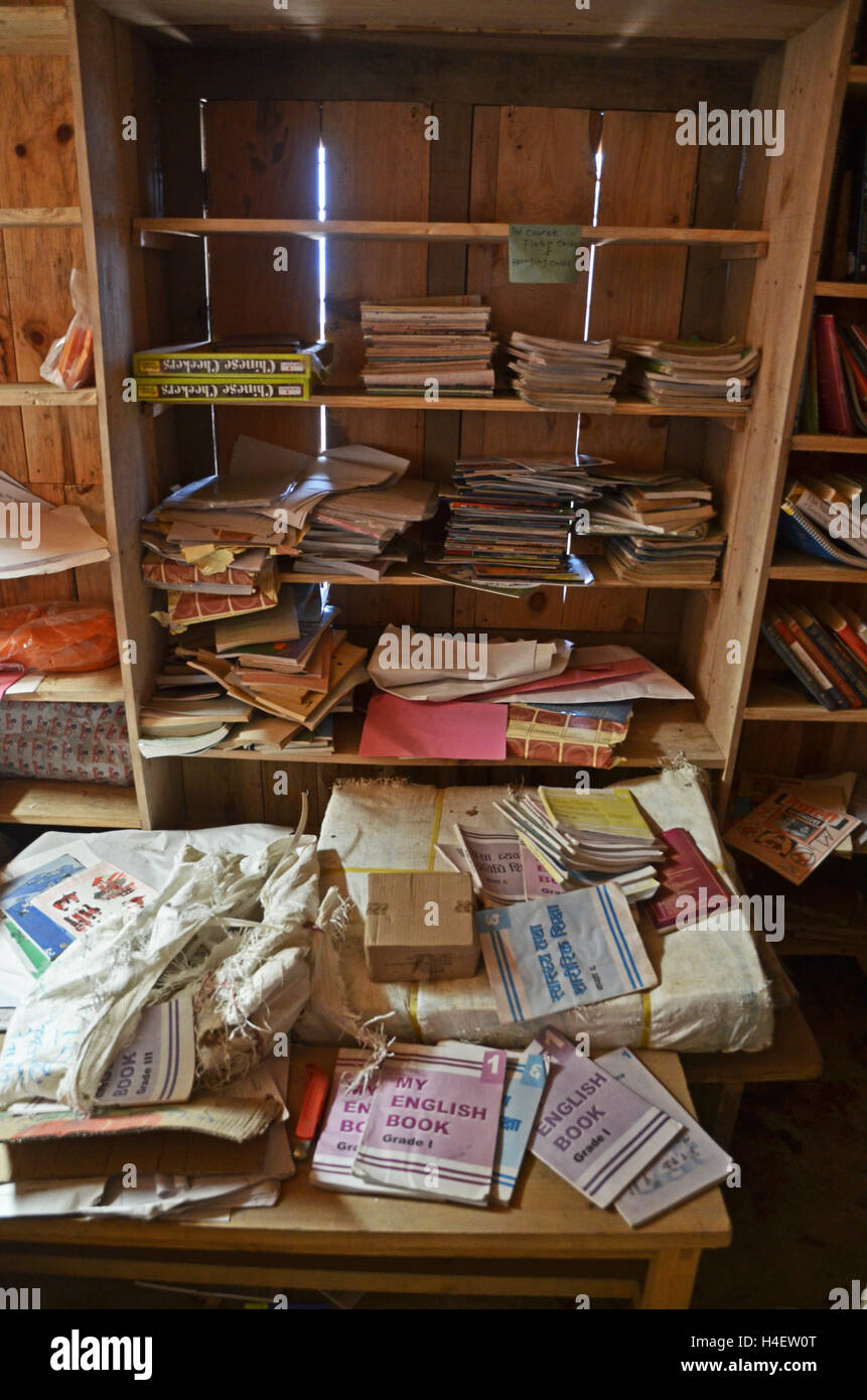 Scattered schoolbooks in a store room in the school in the village of Nele, Solukhumbu, Nepal Stock Photo