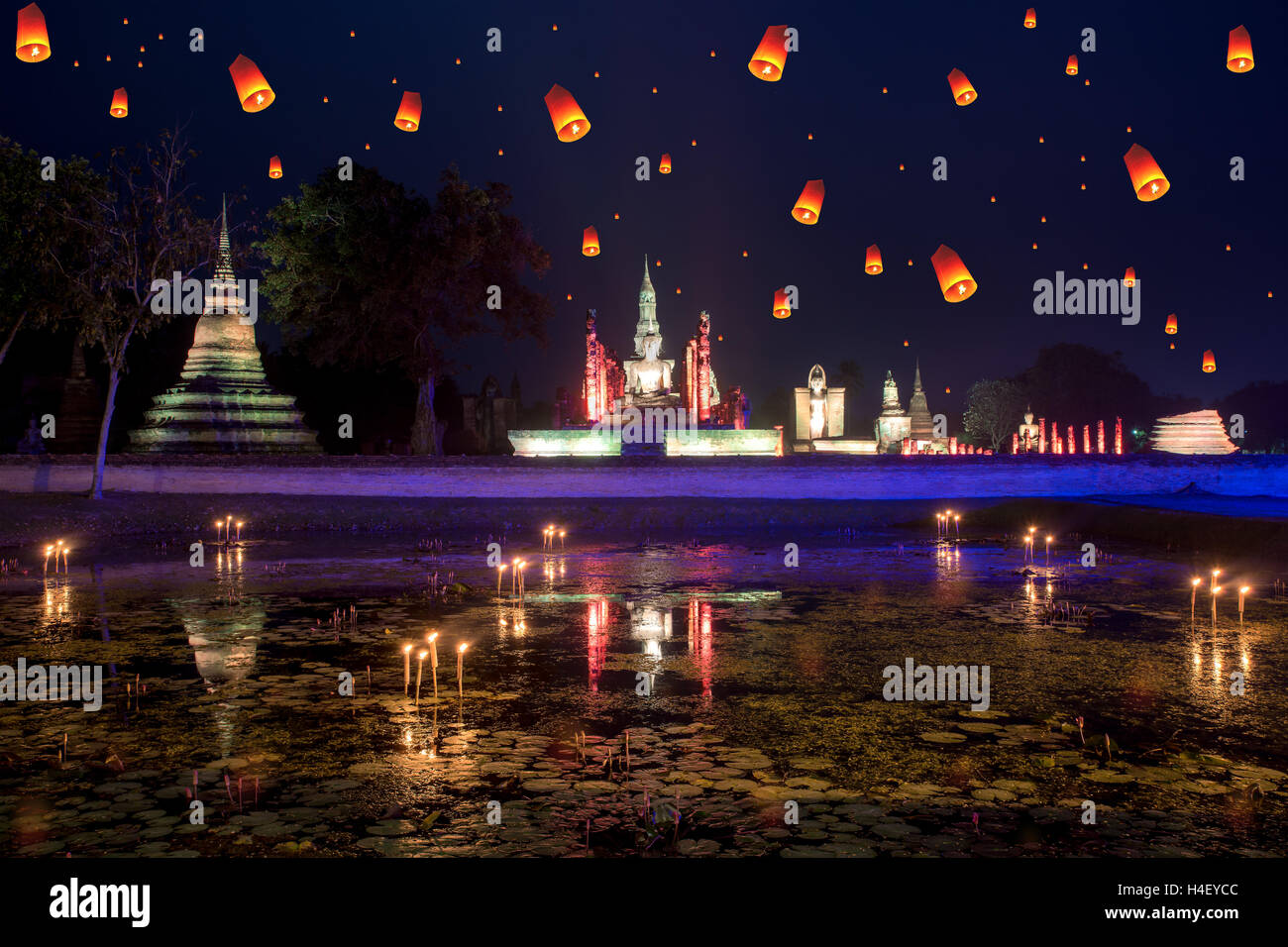 Buddha Statue at Wat Mahathat in Sukhothai Historical Park with  lantern in loy krathong day at Sukhothai, Thailand. Stock Photo