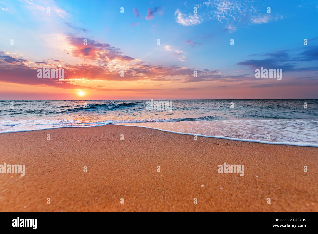 Brilliant ocean beach sunrise. Stock Photo