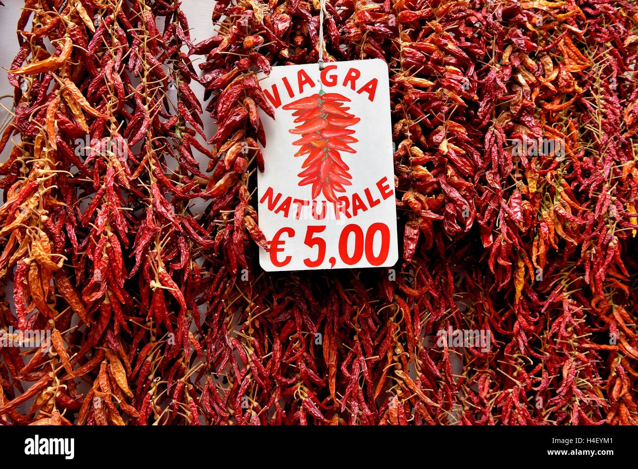 Red chillies on strings, natural Viagra, Amalfi, Campania, Italy Stock Photo