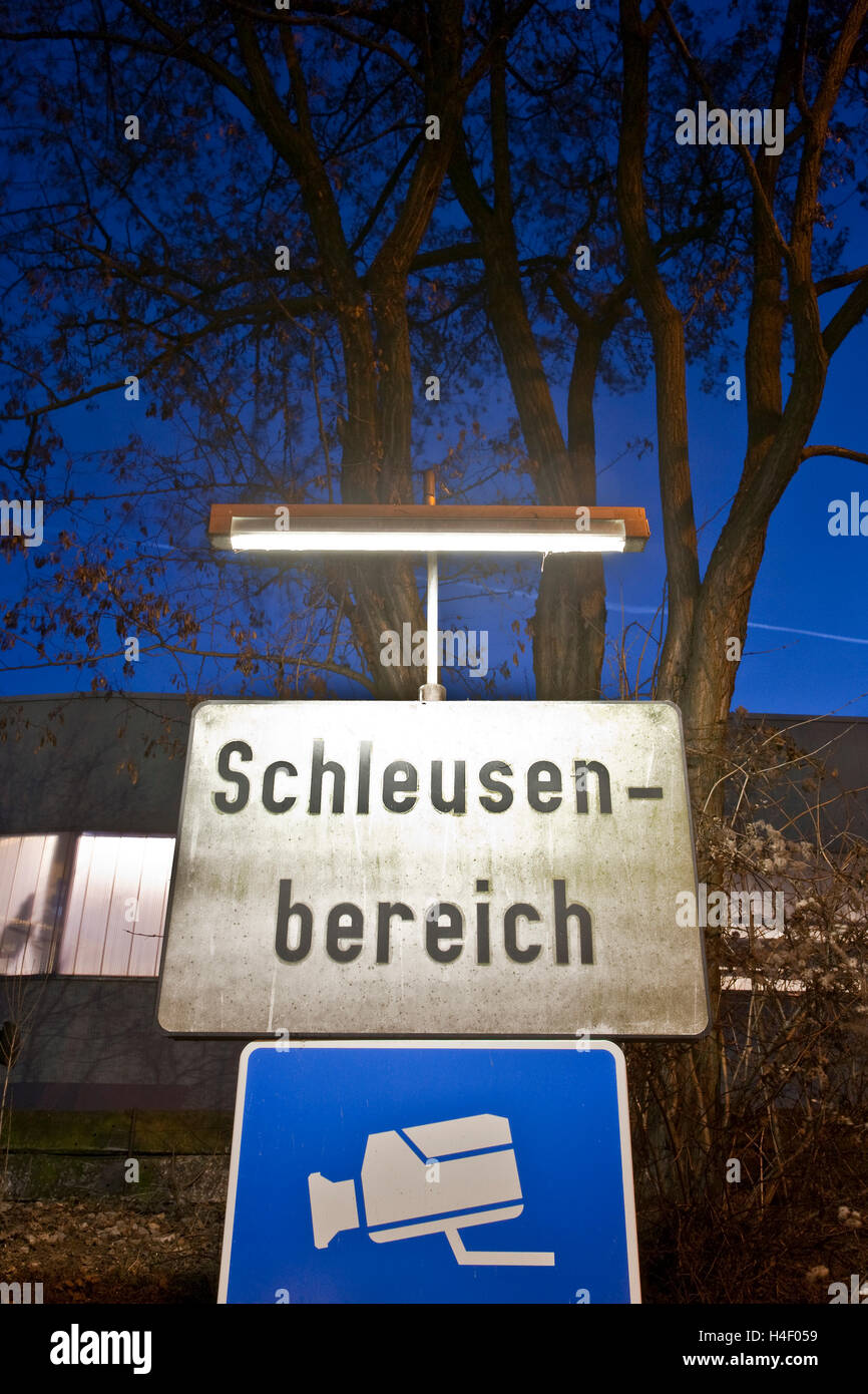 Sign Schleusenbereich or lock area at night, lock, monitored by camera, warning, Neckar river, Stuttgart, Baden-Wuerttemberg Stock Photo