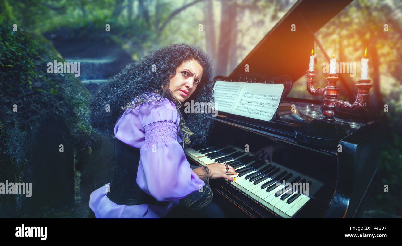 Woman playing the piano Stock Photo