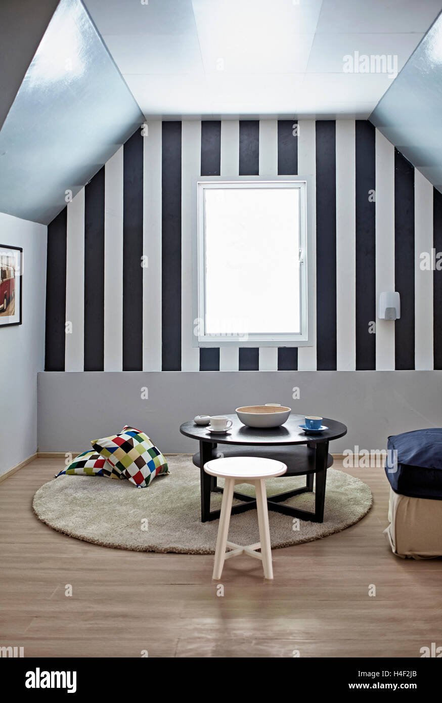 Minimalist furnishing and decor of an attic studio apartment Stock Photo Alamy