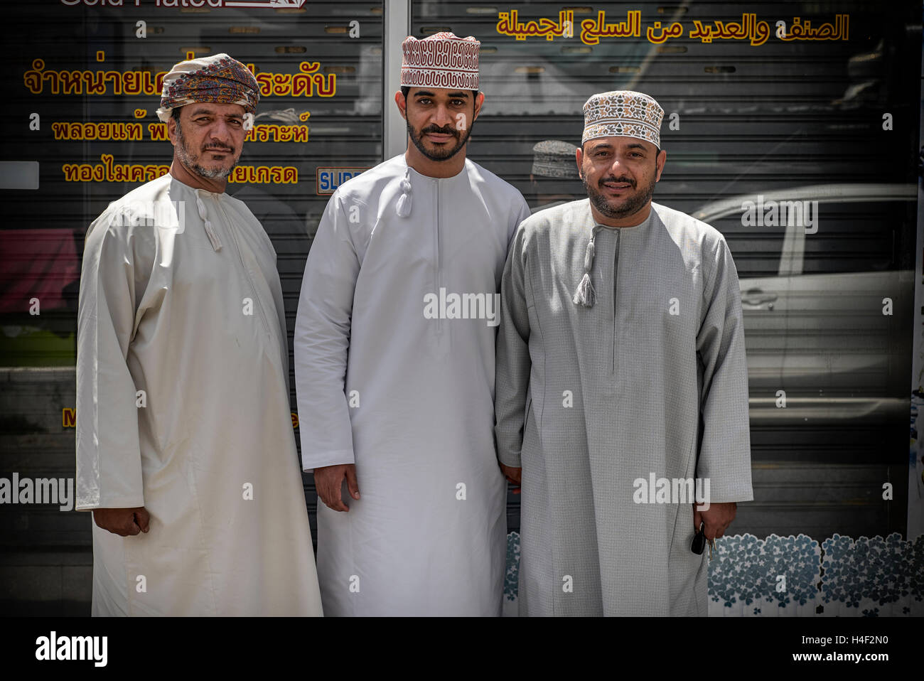 Omani people. Three Middle Eastern men from Oman in traditional dress