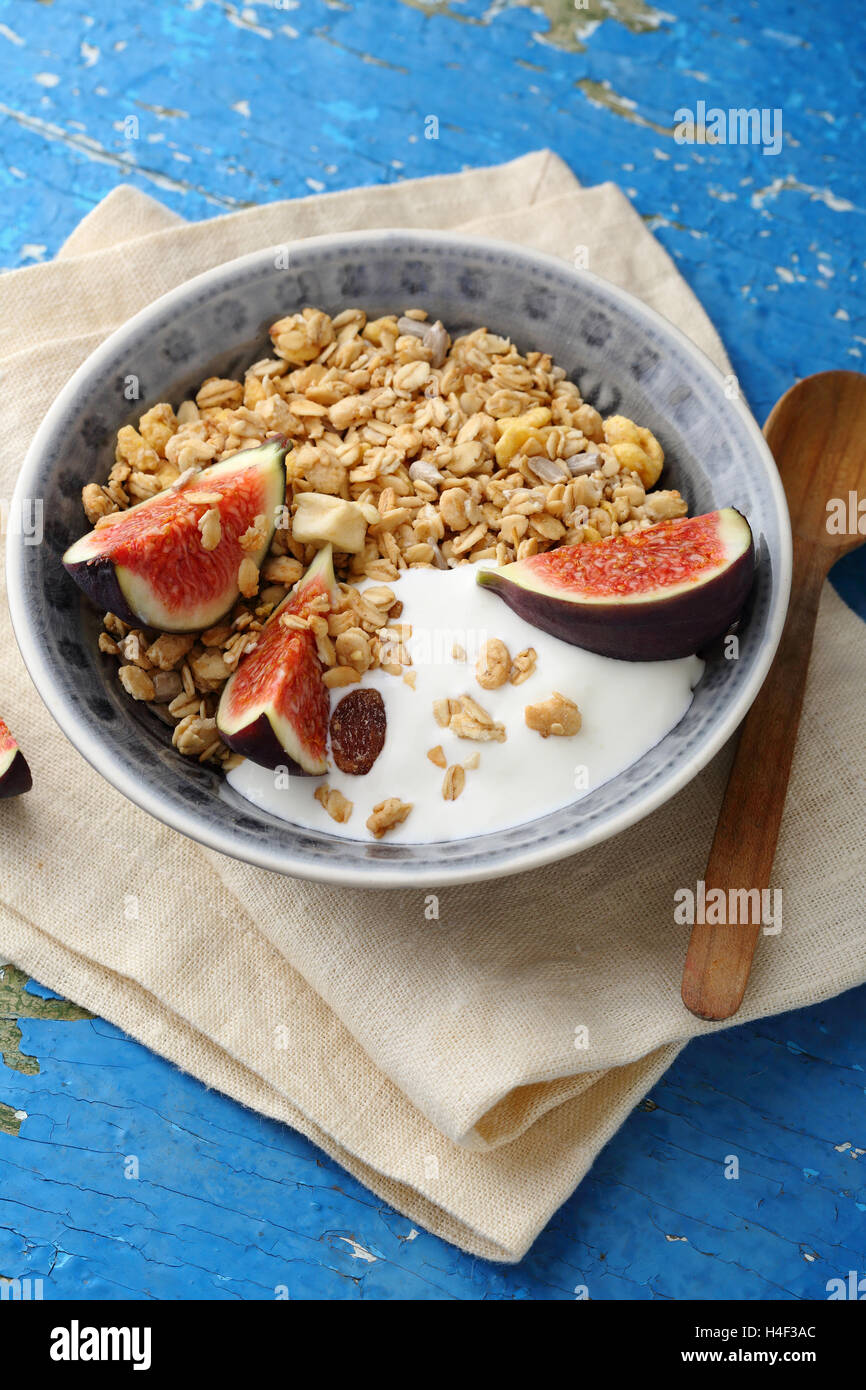 Morning cereal with fig and yoghurt, food closeup Stock Photo