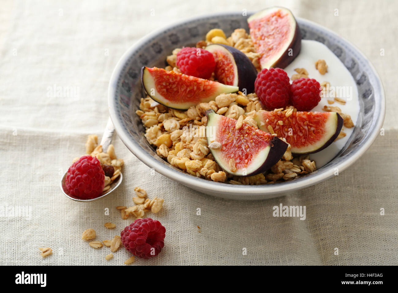 Muesli with figs and raspberry, food closeup Stock Photo