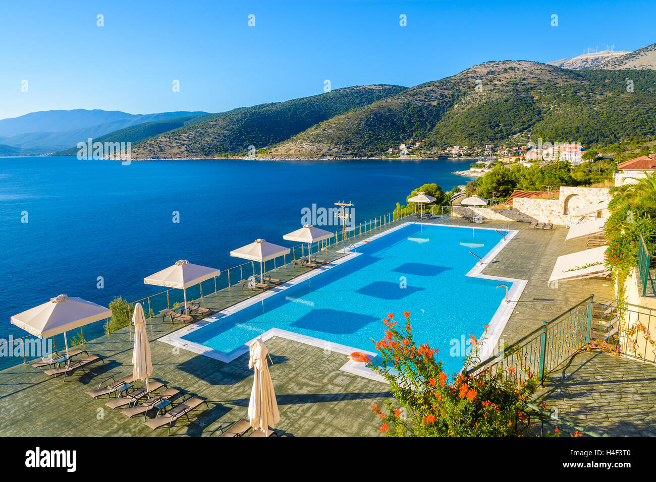 Swimming pool with sea and mountain view on coast of Kefalonia island in Agia Efimia village, Greece Stock Photo