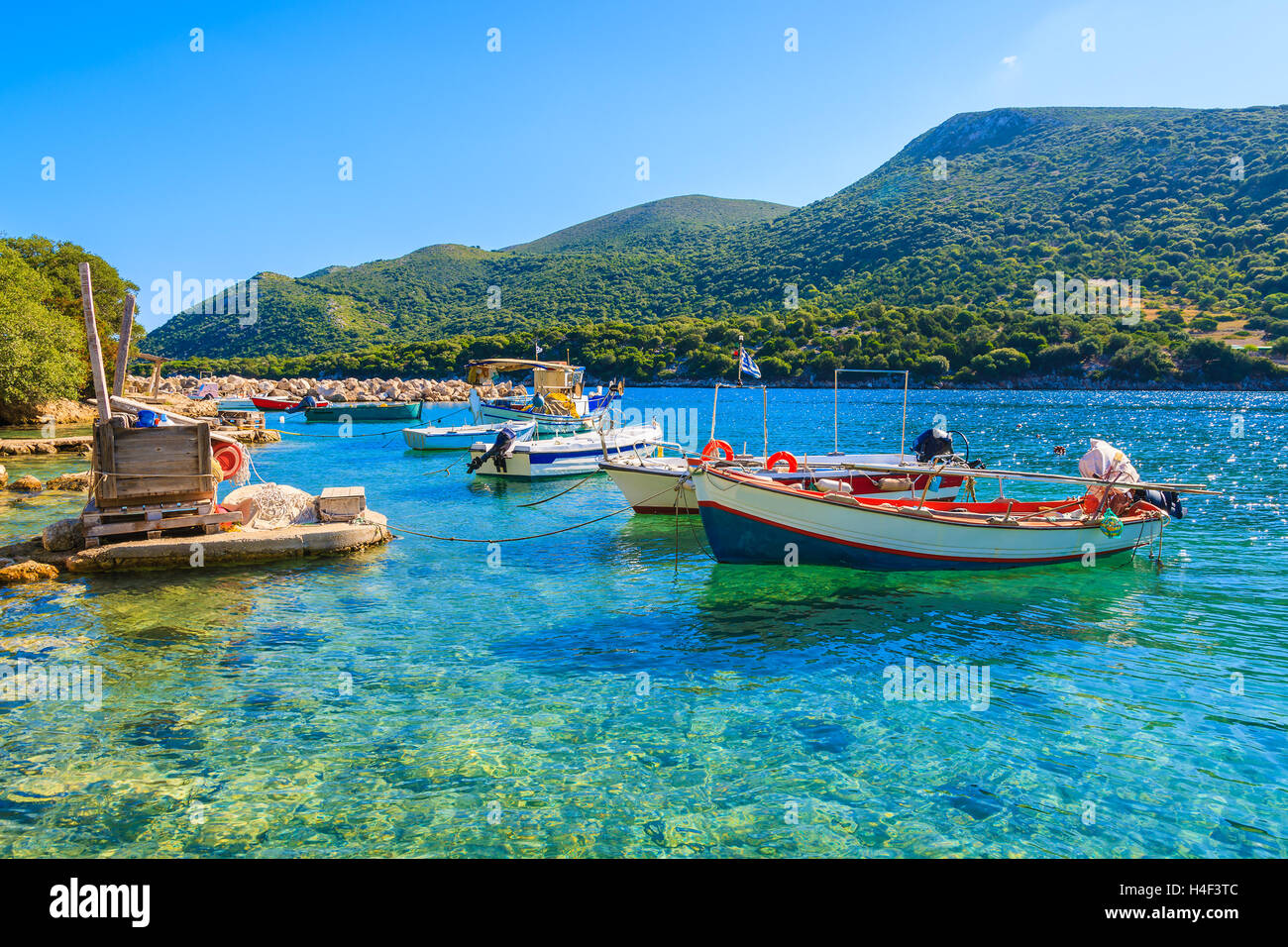 Greek fishing boats on turquoise sea water, Kefalonia island, Greece Stock Photo