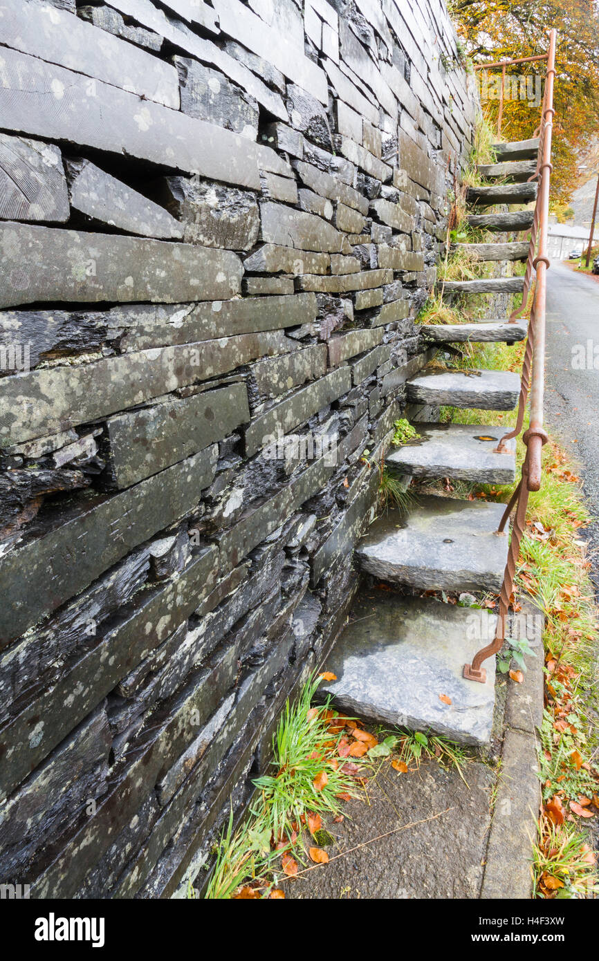 Set of cantilevered steps, made of slate ascending wall. Stock Photo