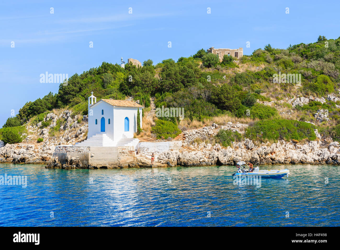Small white church on coast of Ithaka island near Vathi town, Greece Stock Photo