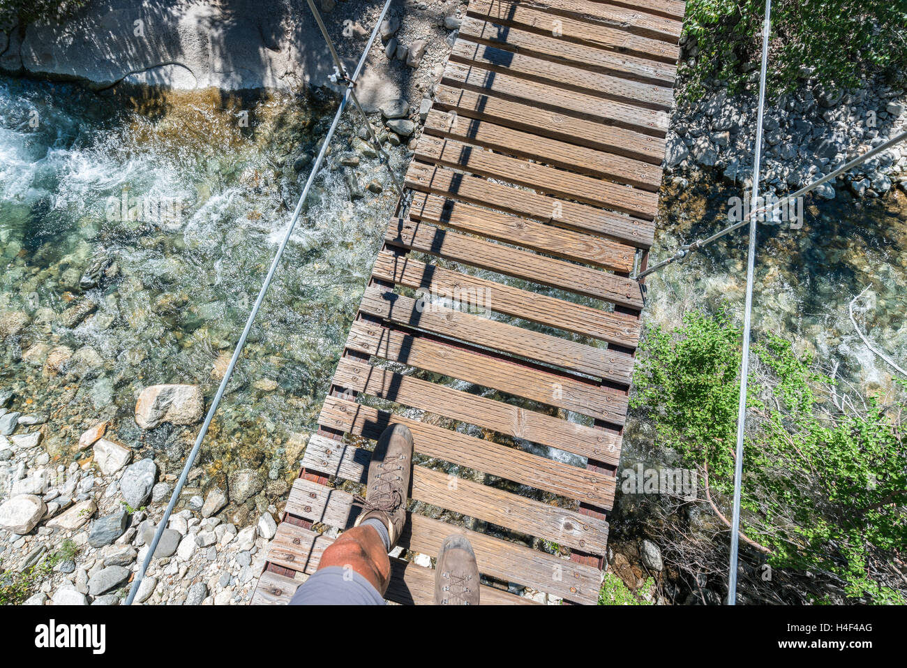 On suspension bridge on John Muir Trail, Sierra Nevada mountains, California, United States of America, North America Stock Photo