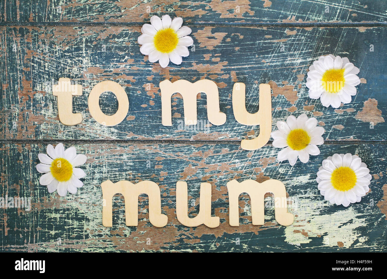 To my mum written with wooden letters on rustic surface Stock Photo