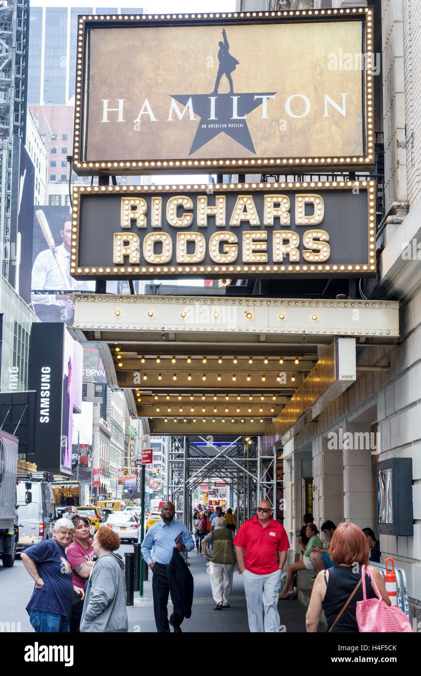 New York City,NY NYC Manhattan,Midtown,Broadway,theater district,Hamilton,Richard Rodgers Theatre,musical,marquee,front,entrance,adult adults,woman fe Stock Photo