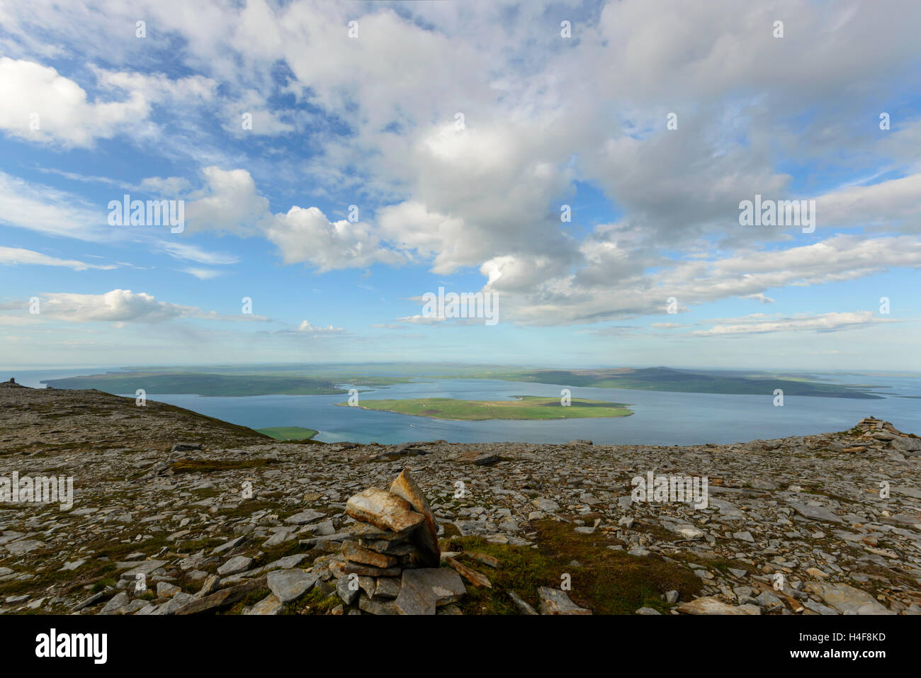 View north to Graemsay Island and onto Stromness (Orkney Mainland) from the summit of Ward Hill on Hoy. Stock Photo