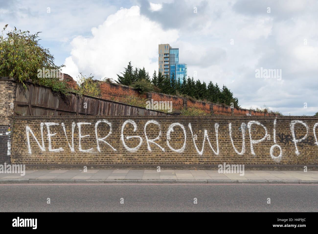 Never Grow Up! Graffiti on Commercial Street, Spitalfields, London, England, UK Stock Photo
