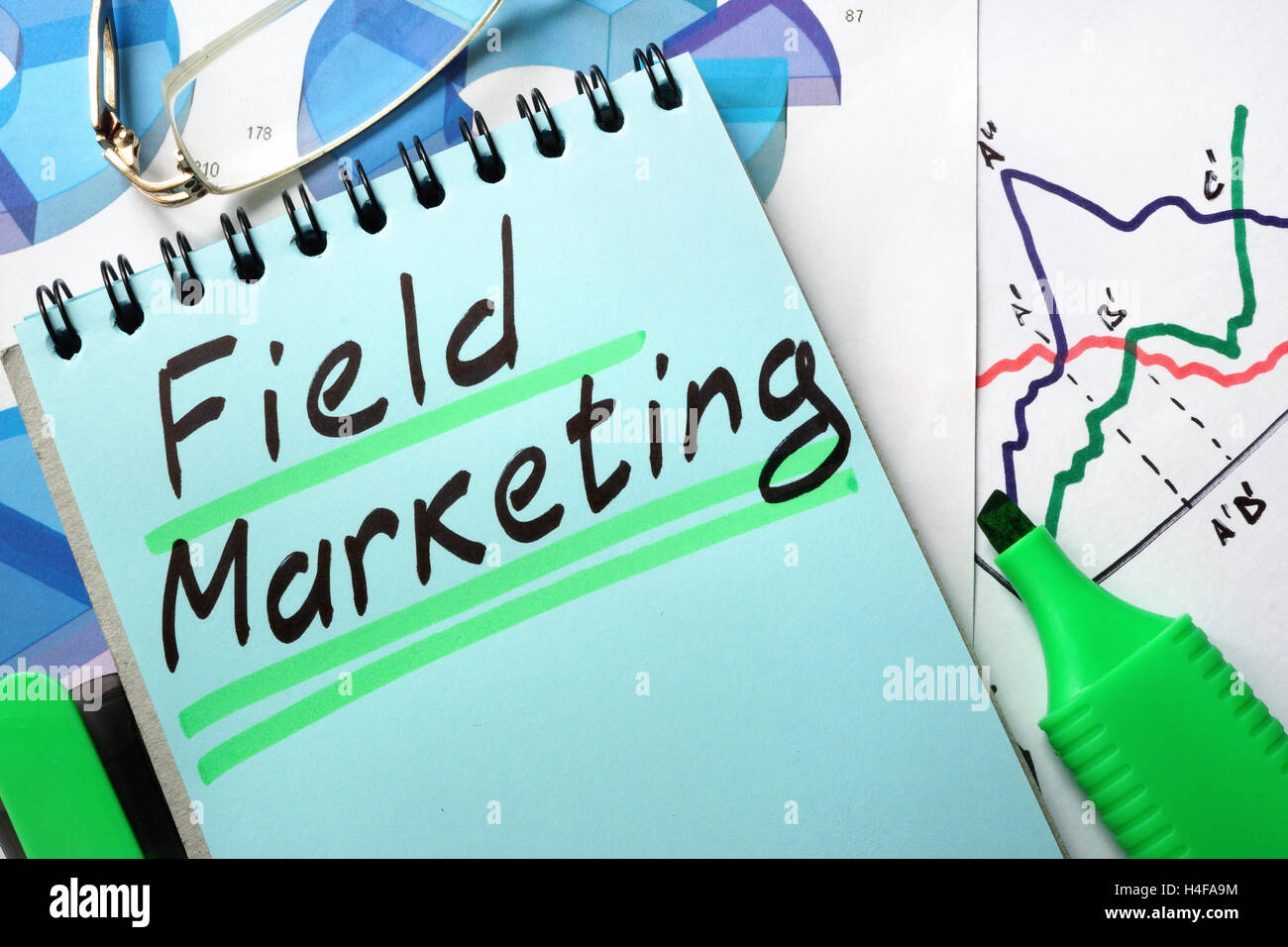 Notepad with sign field marketing on a table. Stock Photo