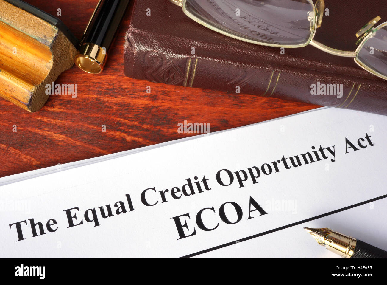 The Equal Credit Opportunity Act (ECOA) and a book. Stock Photo