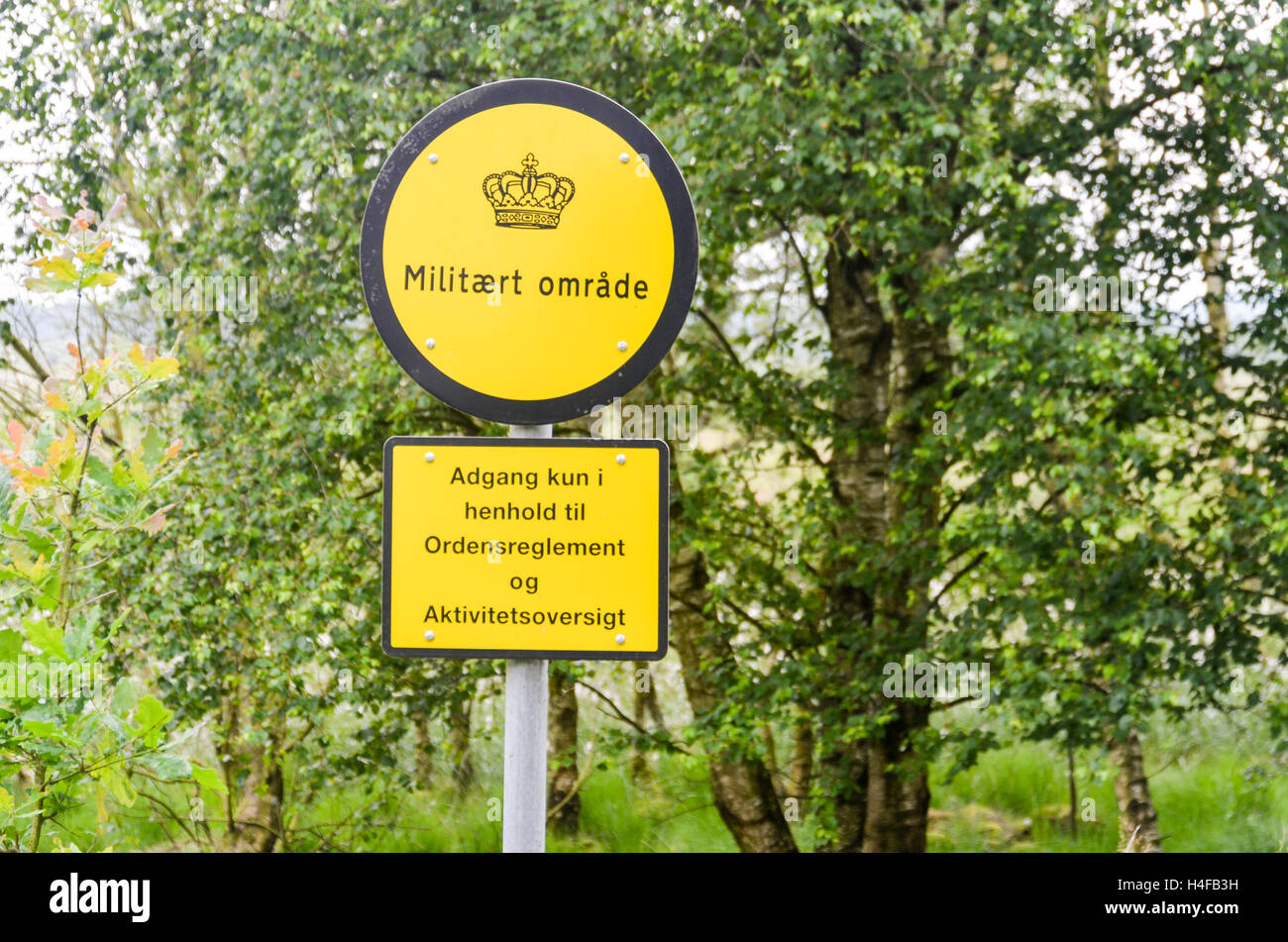 Military sign in Denmark reading Militært område Stock Photo