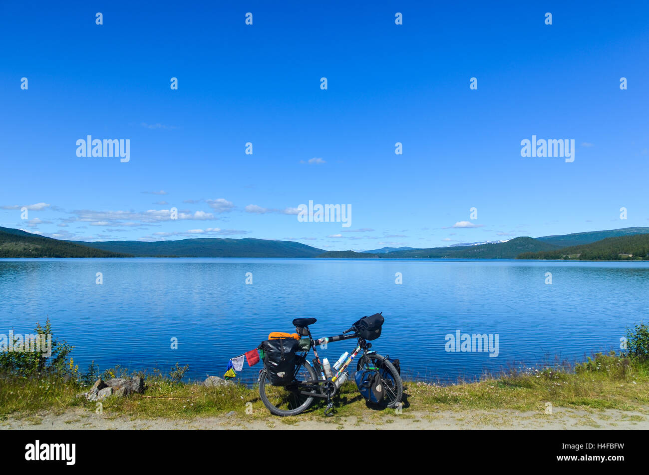 Touring bicycle by a lake in Sweden Stock Photo