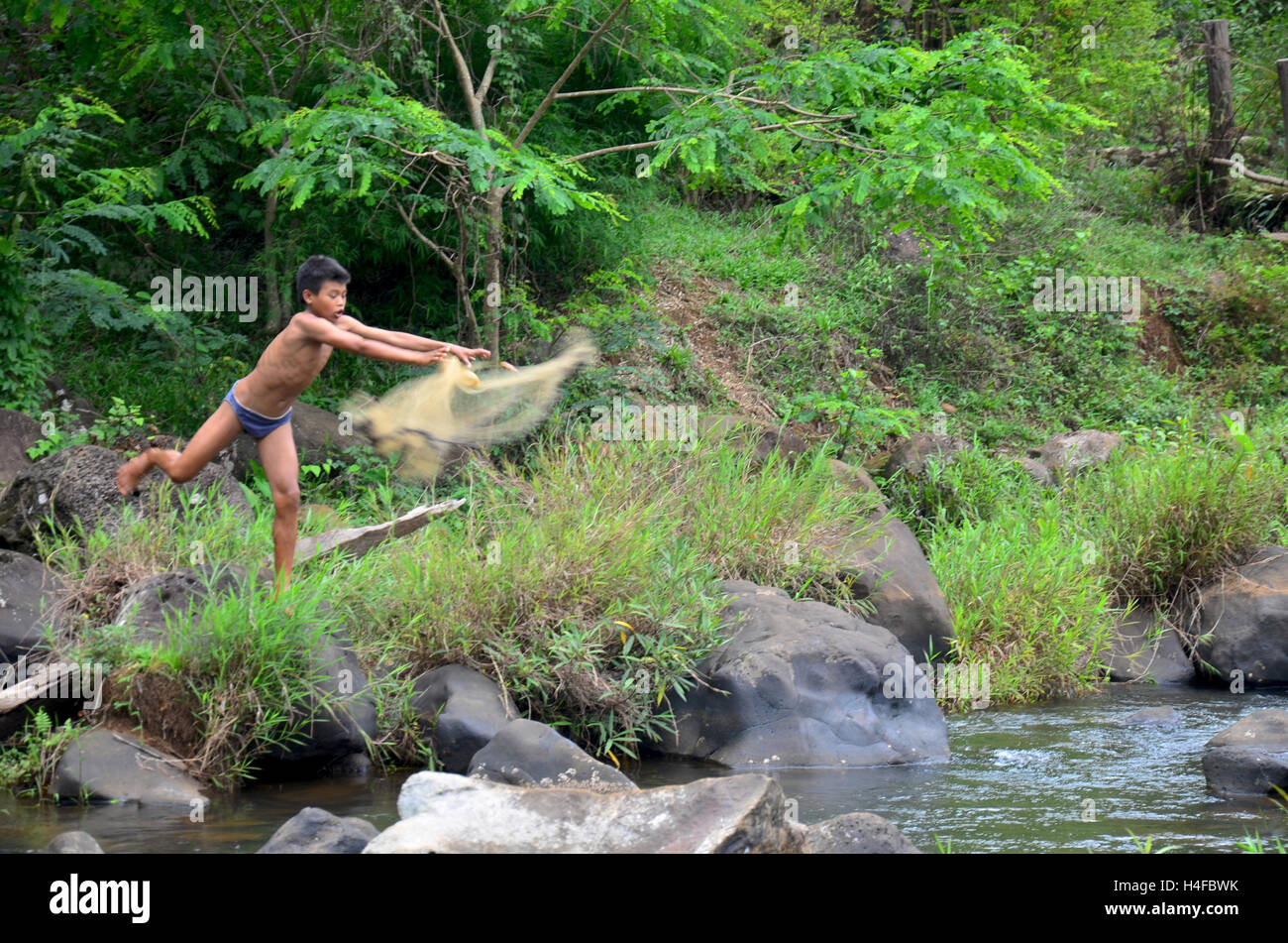Laotian children people used fishing net catch fish in stream of Tad Yeang  waterfall at Bolaven Plateau on May 2, 2015 in Pakson Stock Photo - Alamy