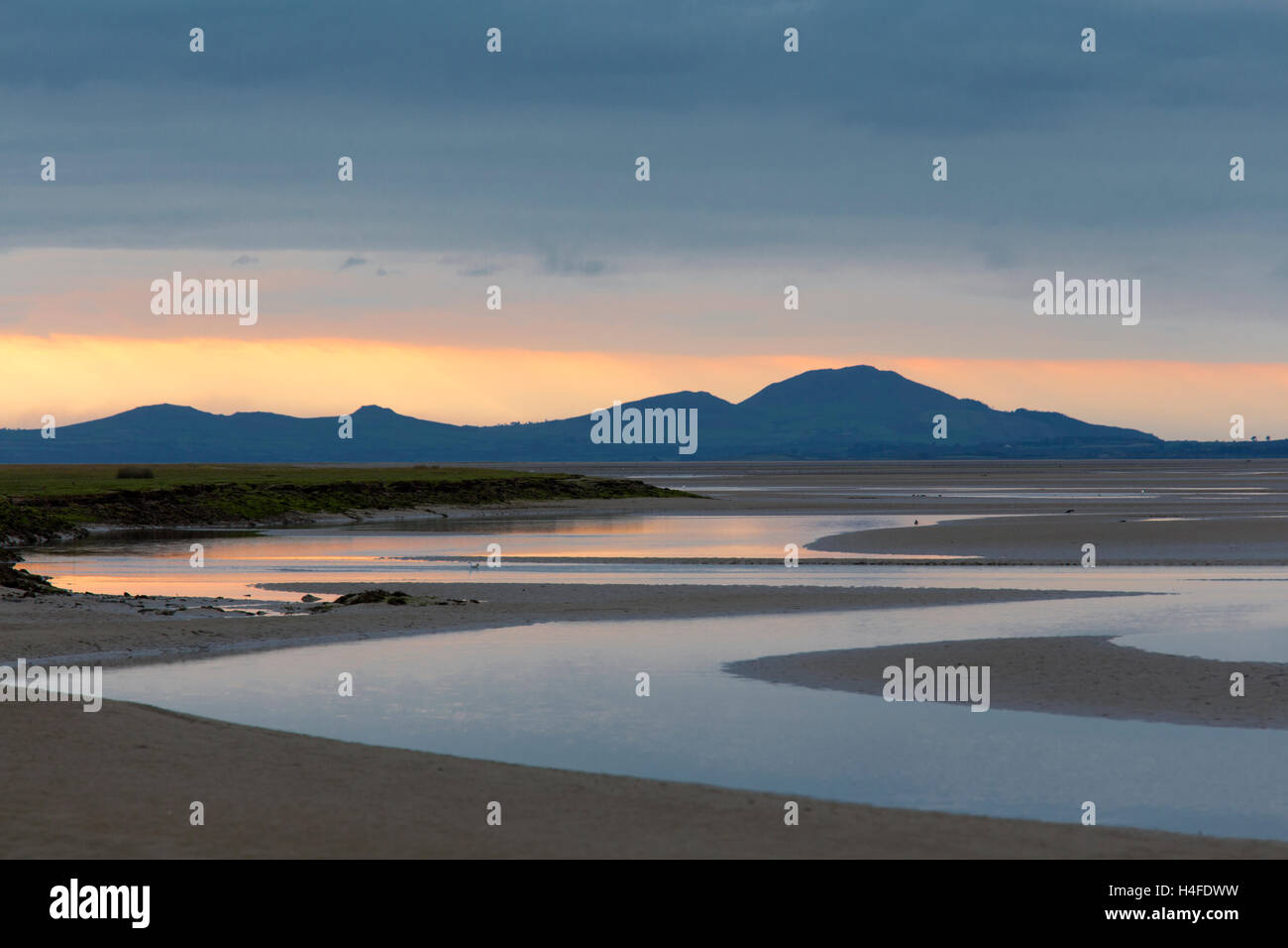 Sunset over the Llyn Peninsula from the Afon Glaslyn, Snowdonia National Park, North Wales, UK Stock Photo