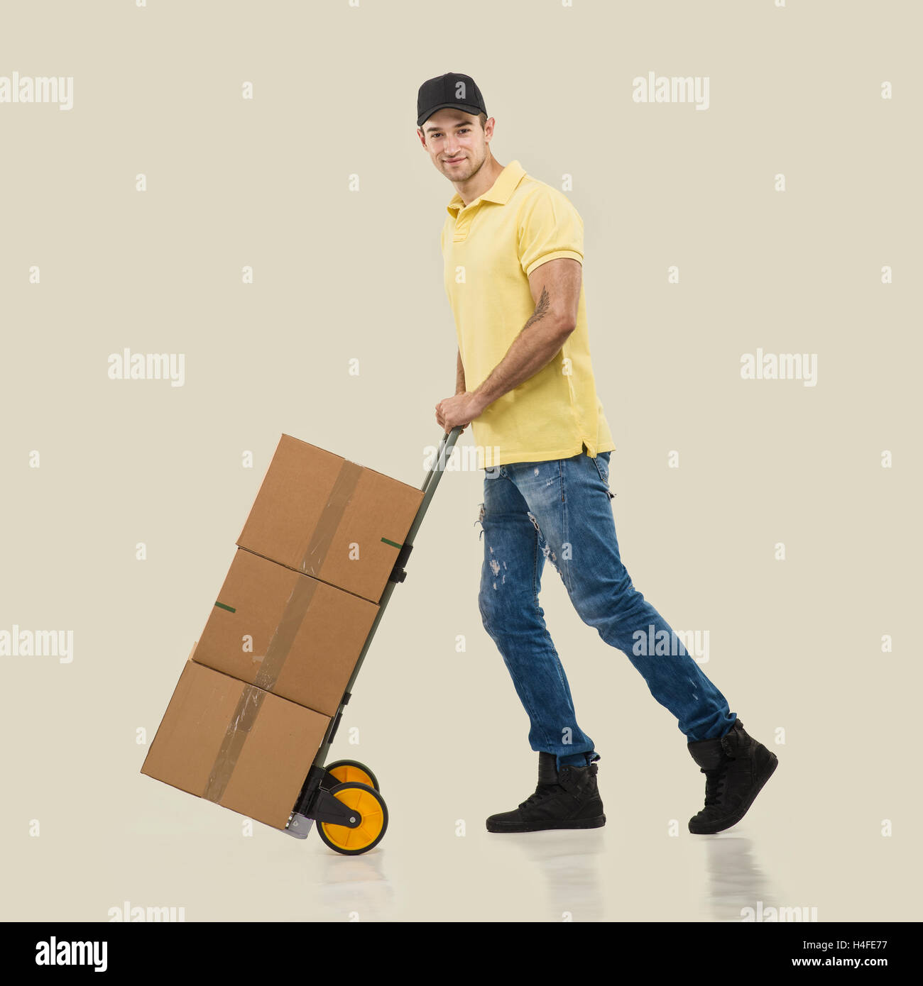 Courier - a handcart packages Stock Photo