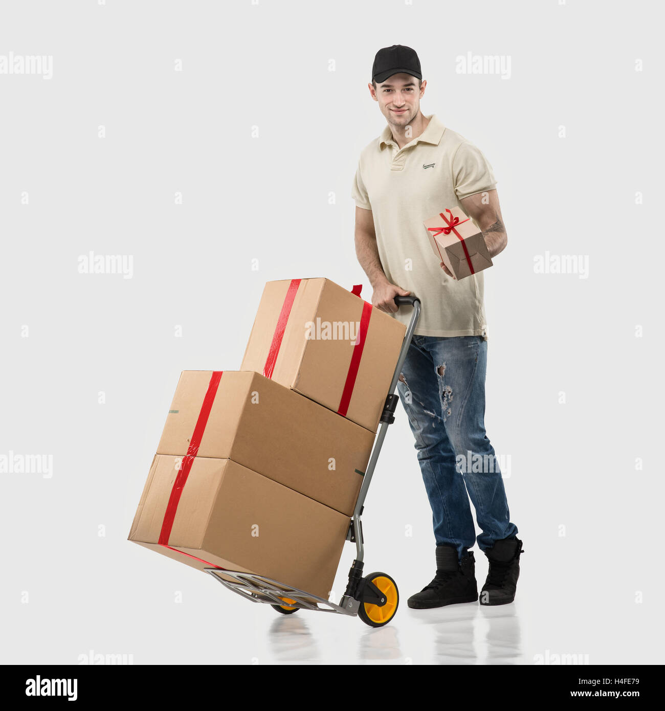 Courier, a handcart gift boxes Stock Photo