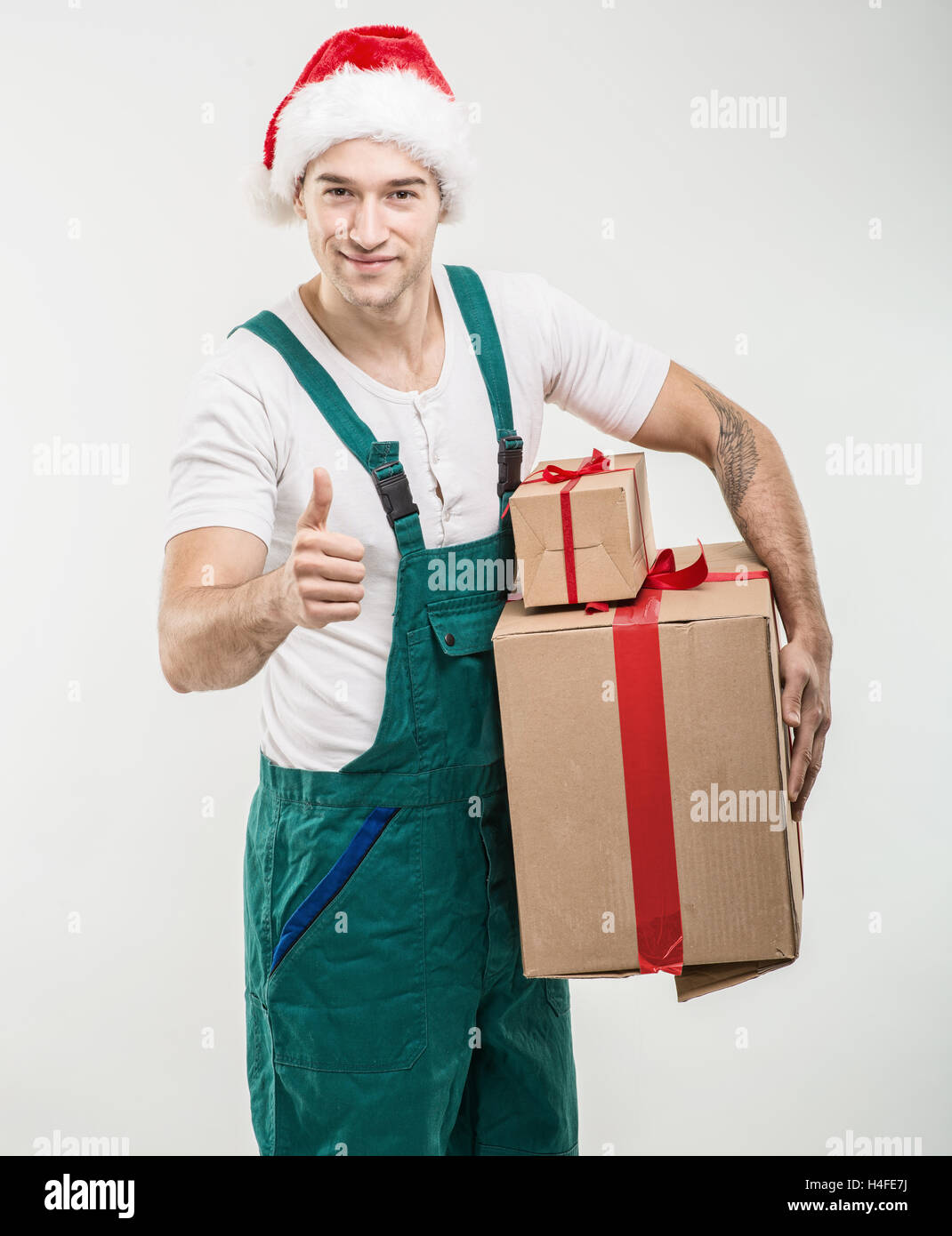 Courier - In the hands of boxes, gift Stock Photo
