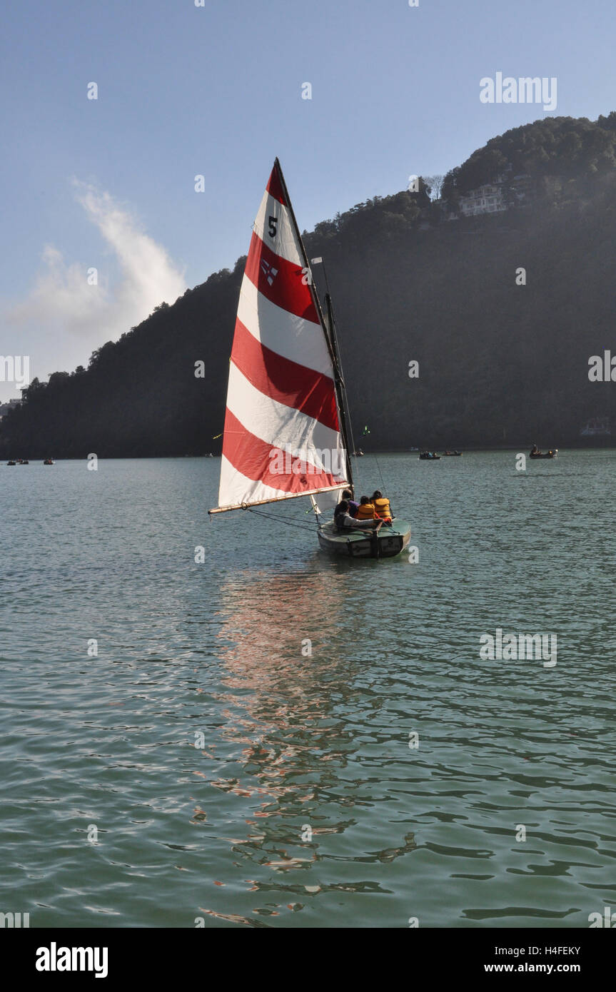 Nainital, Uttarakhand, India- November 13, 2015: Yacht sailing in the Nainil  Lake at Mallital, Nainital, Uttarakhand, India.  N Stock Photo