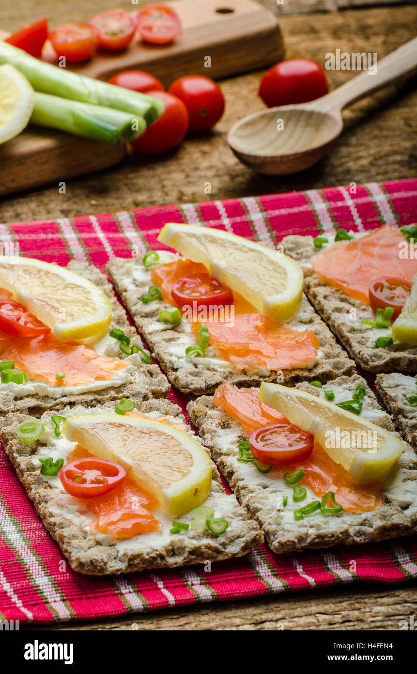 Bio healthy food kneckebrot spread cheese with smoked salmon and