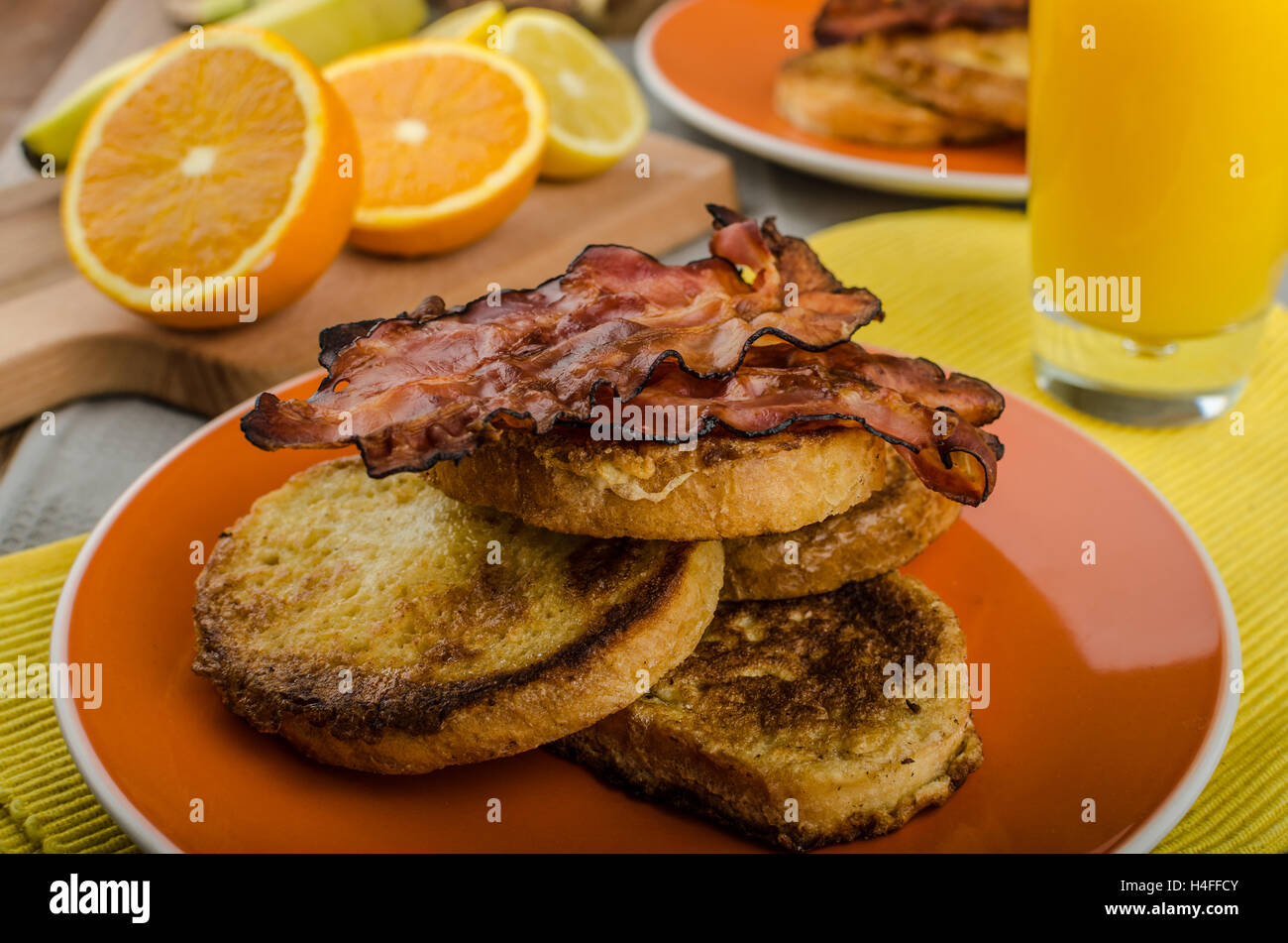 French toast with bacon and fresh juice from oranges Stock Photo