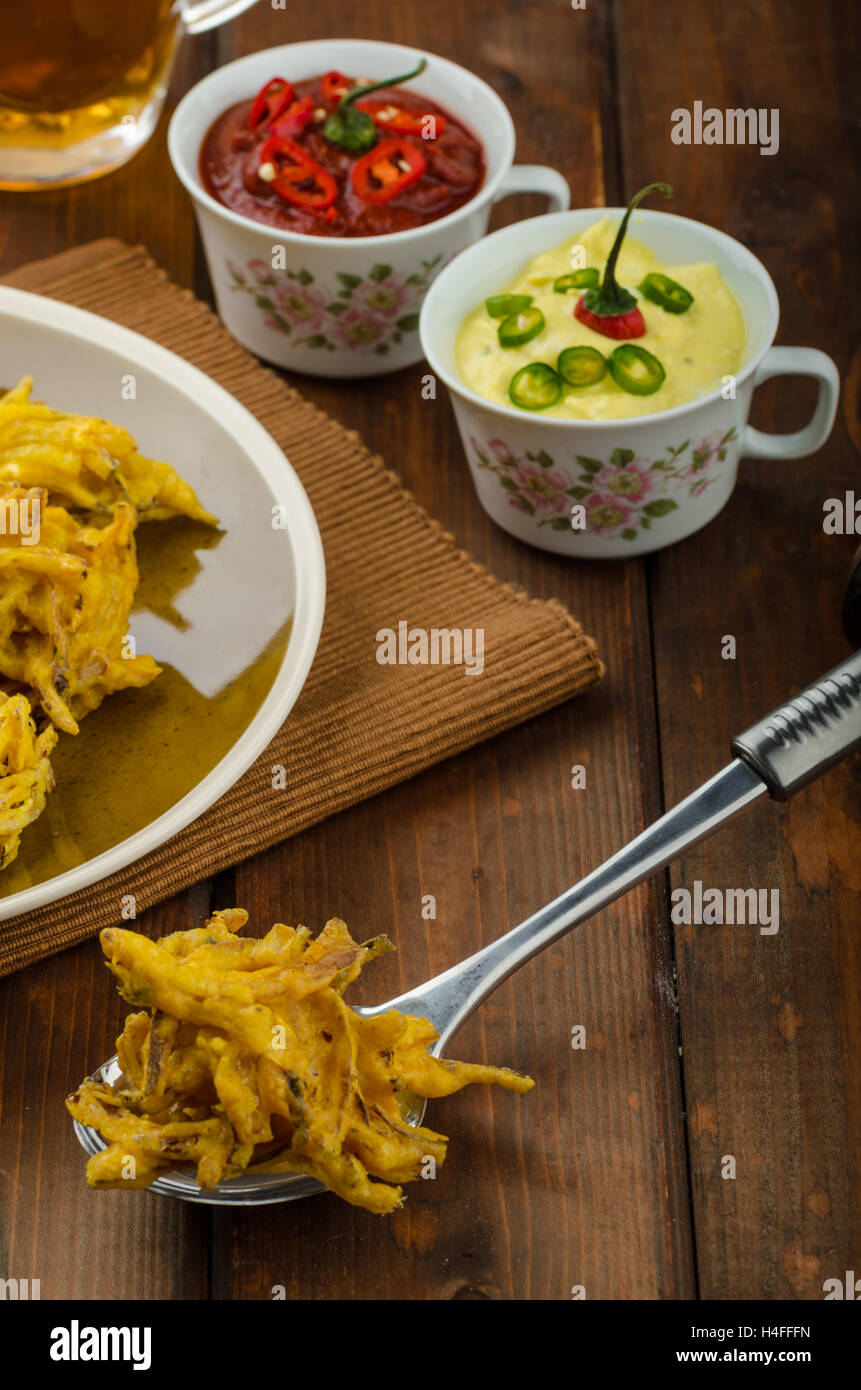 Indian spicy onion bhajis dipping sauce hires stock photography and