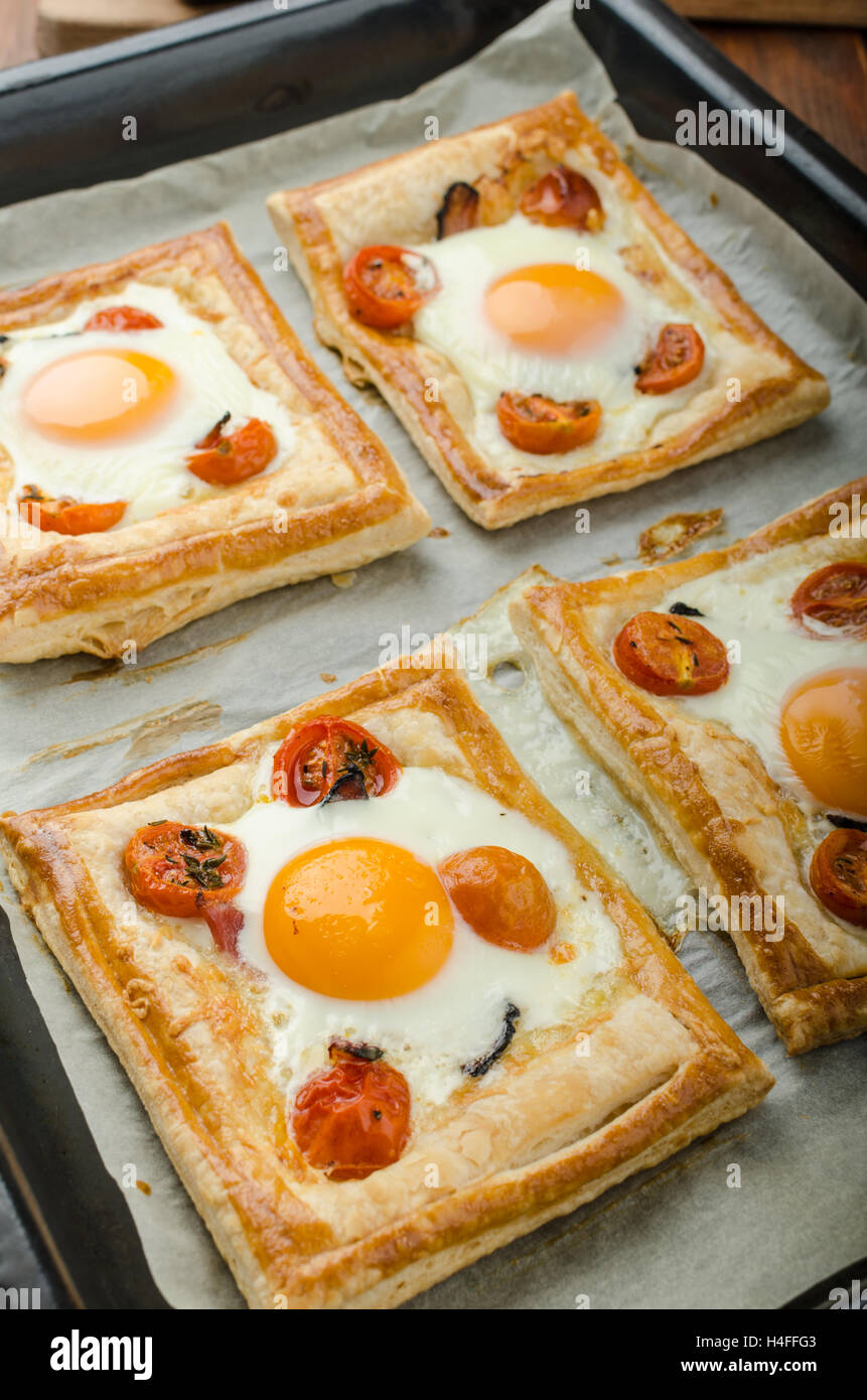 Tomato, Egg, and Prosciutto Tart from puff pastry, baked in oven Stock Photo Alamy
