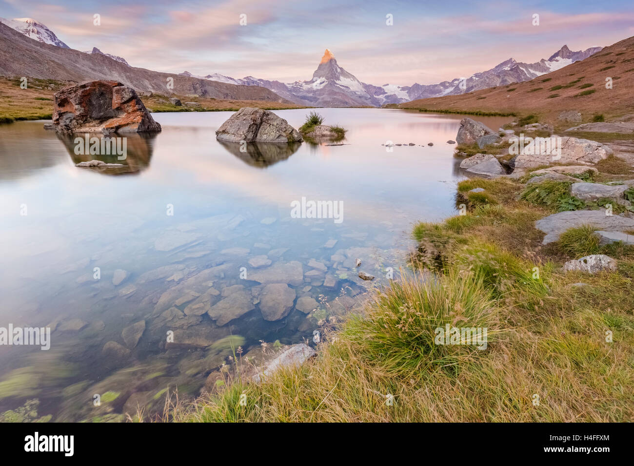 Dawn at Stellisee Lake with the Matterhorn reflecting, Zermatt, Switzerland Stock Photo