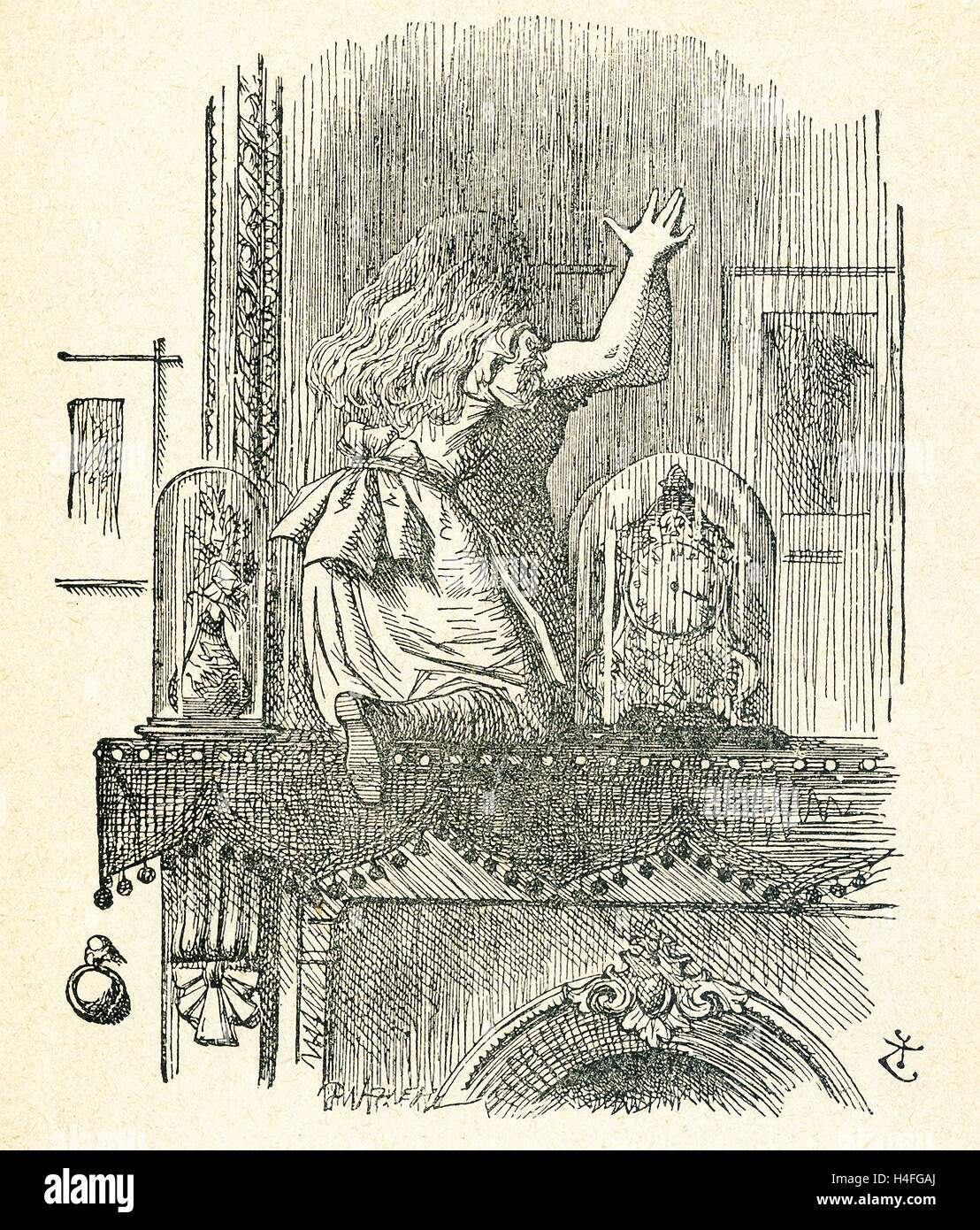 This illustration of Alice climbing up on the fireplace mantel  and about to poke the looking glass (mirror) is from 'Through the Looking-Glass and What Alice Found There' by Lewis Carroll (Charles Lutwidge Dodgson), who wrote this novel in 1871 as a sequel to 'Alice's Adventures in Wonderland.' Alice does step through the mirror into another world. Stock Photo