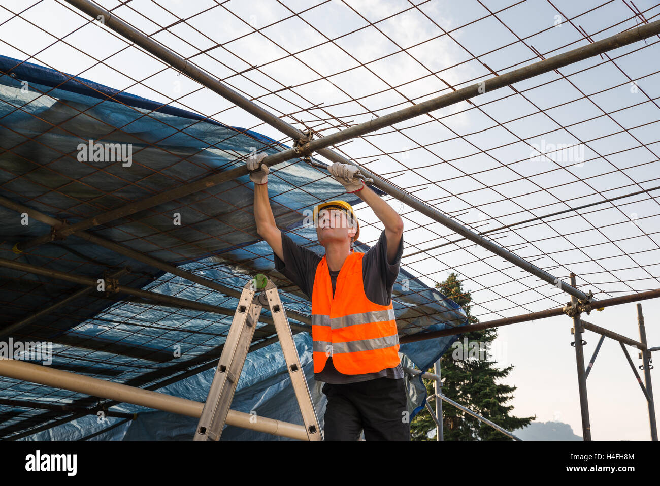 Construction worker with helmet and reflective jacket Stock Photo Alamy