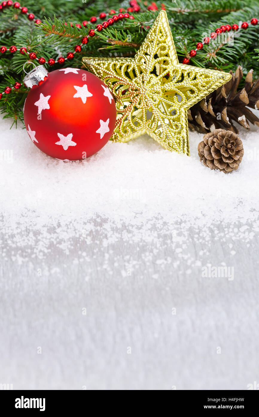 christmas ball and ornate golden star with fir branches and cones Stock Photo